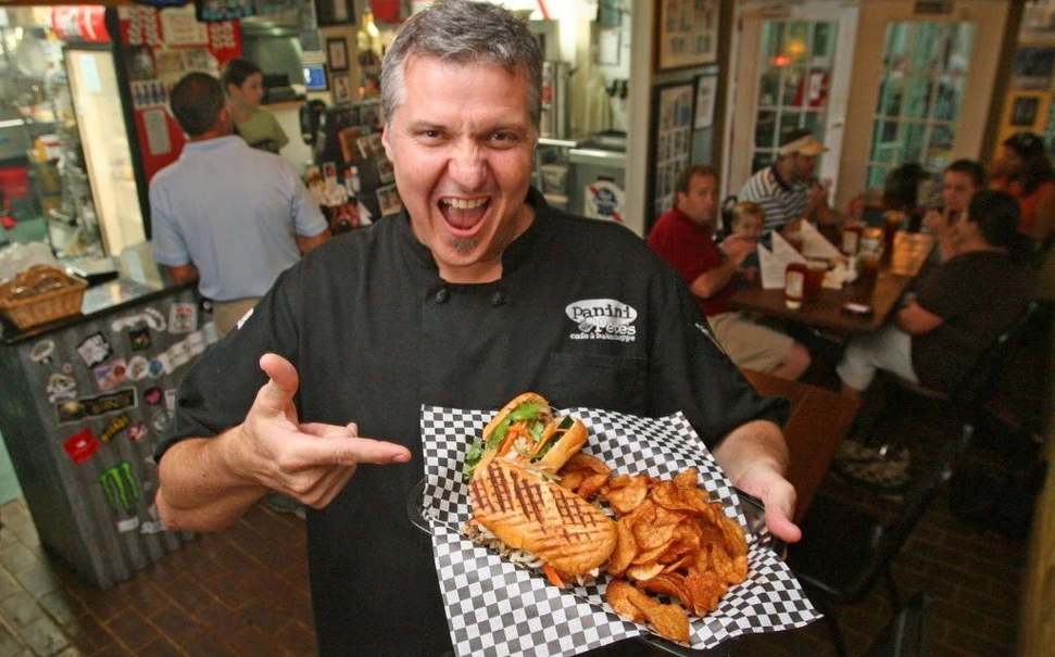 chef holding sandwich at panini pete's in fairhope alabama